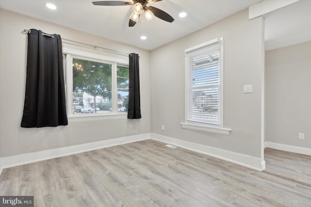 empty room featuring light hardwood / wood-style flooring and ceiling fan