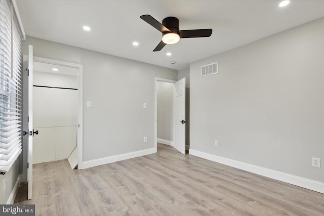 unfurnished bedroom featuring light hardwood / wood-style flooring and ceiling fan