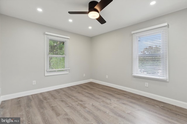 spare room with ceiling fan and light hardwood / wood-style flooring