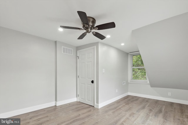 additional living space featuring light hardwood / wood-style floors and ceiling fan