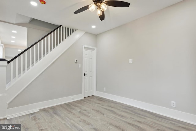 interior space with ceiling fan and hardwood / wood-style floors