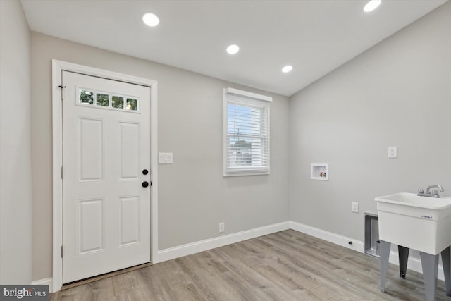 washroom featuring light hardwood / wood-style flooring and washer hookup