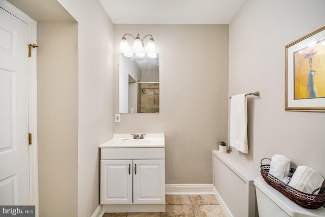 bathroom with walk in shower, vanity, and toilet