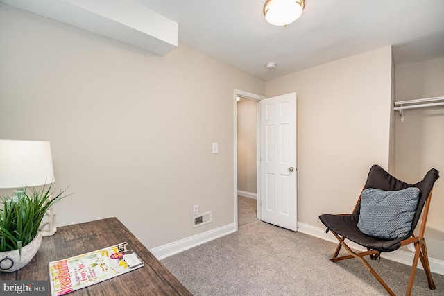 sitting room featuring carpet