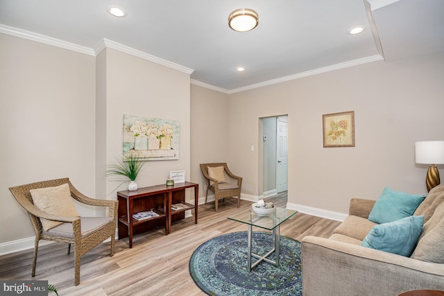 living room featuring hardwood / wood-style flooring and crown molding