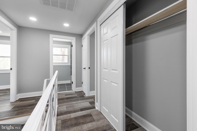 staircase featuring wood-type flooring