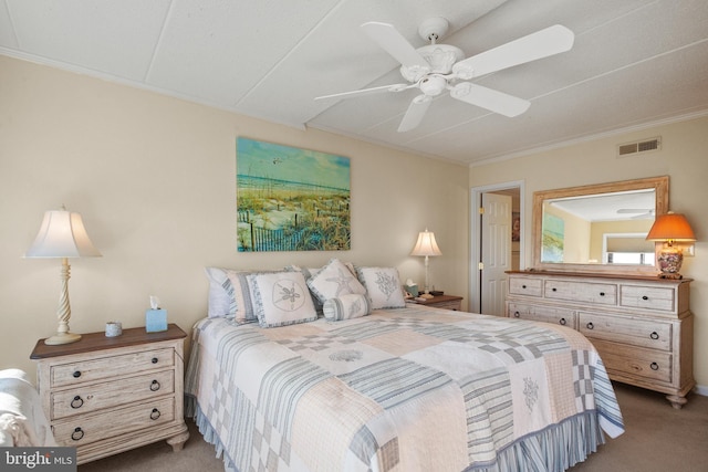 bedroom with ceiling fan, light carpet, and ornamental molding