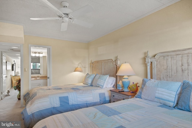 carpeted bedroom with ensuite bathroom, ceiling fan, crown molding, lofted ceiling, and a textured ceiling