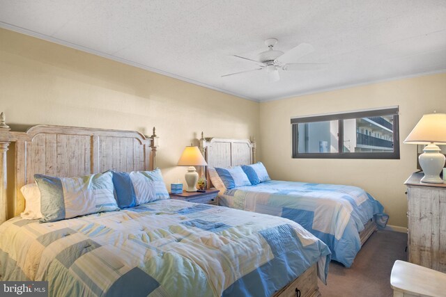 bedroom with crown molding, carpet, a textured ceiling, and ceiling fan