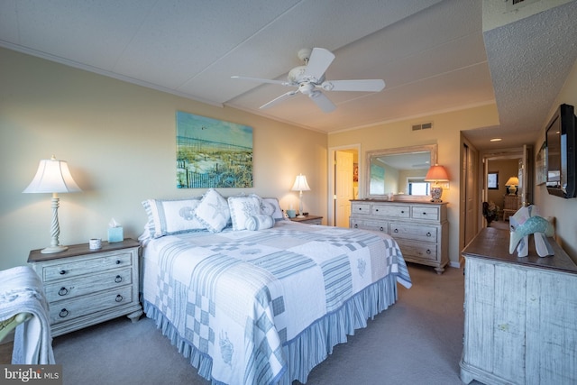 carpeted bedroom with ornamental molding, a textured ceiling, and ceiling fan