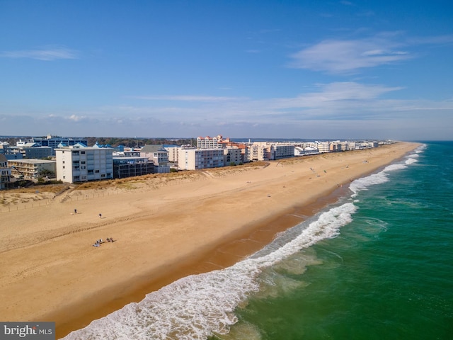 drone / aerial view with a water view and a view of the beach