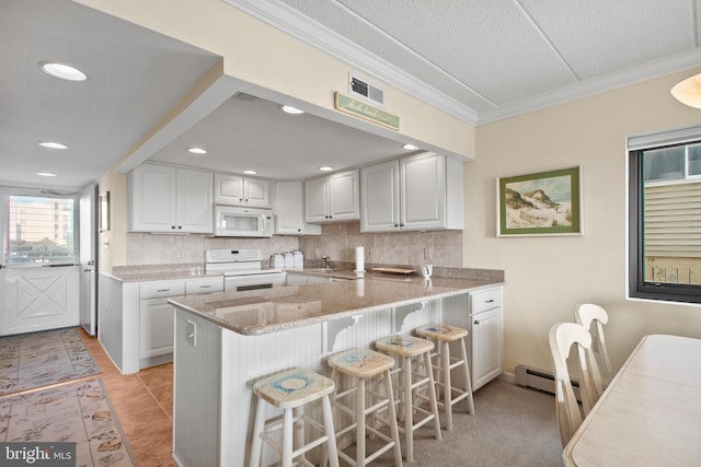 13700 Wight St Unit 1N01, Ocean City, MD 21842 - kitchen with backsplash, white appliances, ornamental molding, and a peninsula