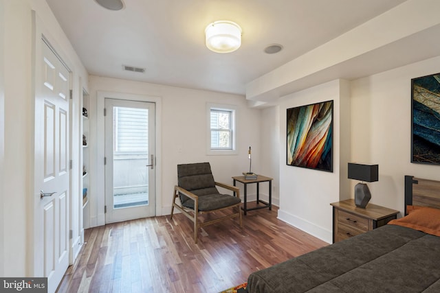 sitting room featuring dark hardwood / wood-style flooring