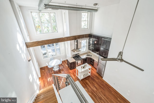 living room featuring hardwood / wood-style floors and ceiling fan