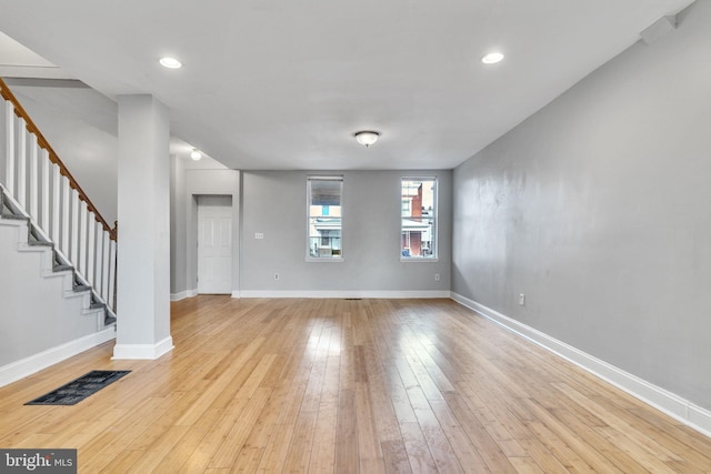 unfurnished living room with light hardwood / wood-style floors