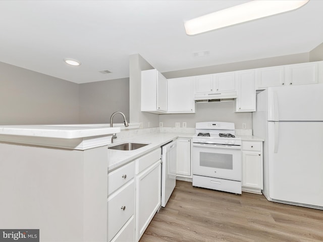 kitchen with sink, light hardwood / wood-style floors, white cabinetry, and white appliances