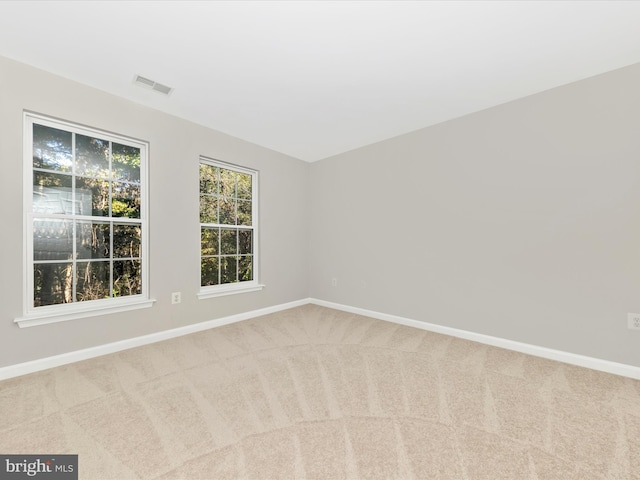 unfurnished room featuring carpet flooring