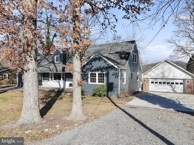 view of front facade with an outdoor structure and a garage