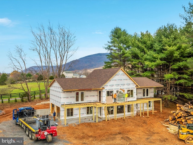 rear view of property with a mountain view