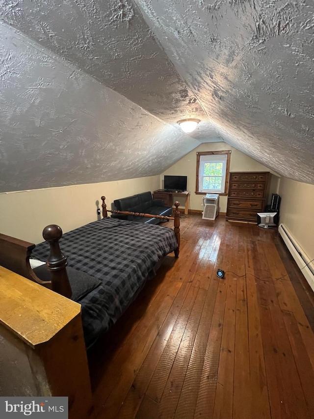 bedroom with a textured ceiling, lofted ceiling, baseboard heating, and dark wood-type flooring