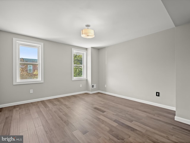 empty room featuring hardwood / wood-style flooring