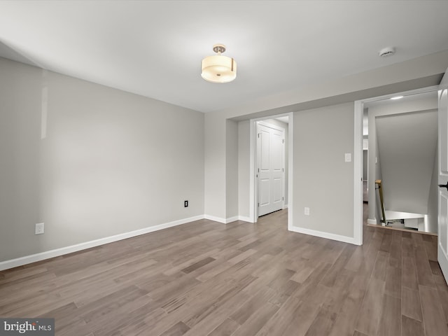 spare room featuring light wood-type flooring