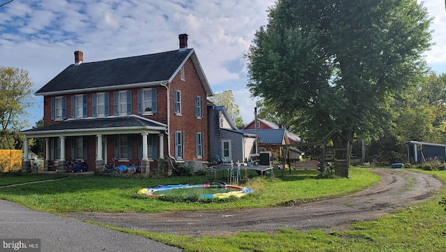 view of front facade with a porch and a front yard