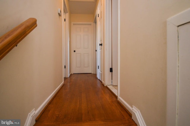 hallway with wood-type flooring