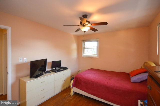 bedroom featuring dark hardwood / wood-style flooring and ceiling fan