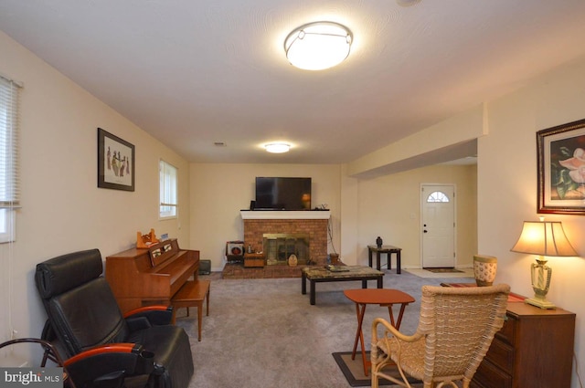 living room with carpet floors and a fireplace