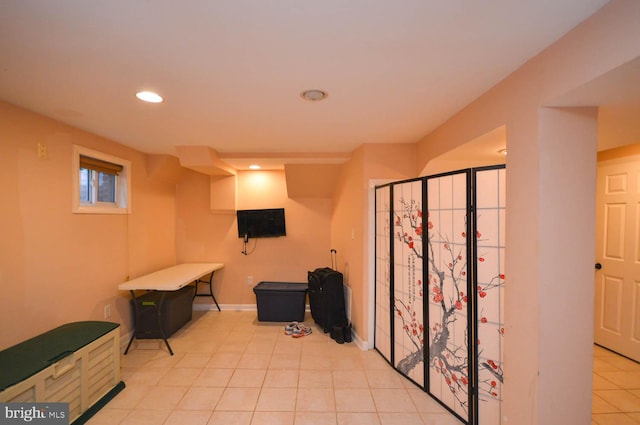 basement with light tile patterned flooring