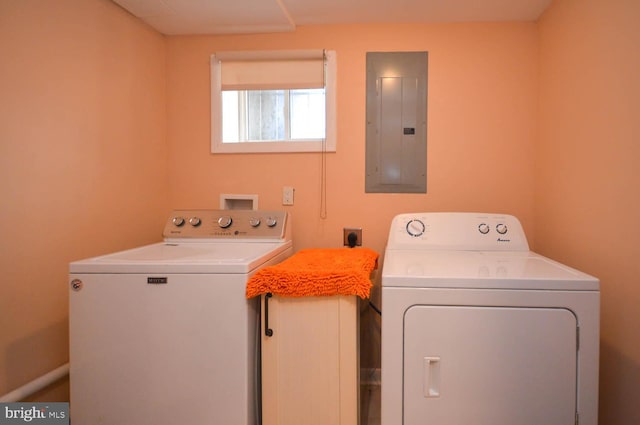 clothes washing area featuring independent washer and dryer and electric panel