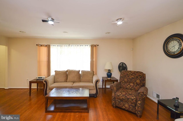 living room featuring ceiling fan and hardwood / wood-style floors