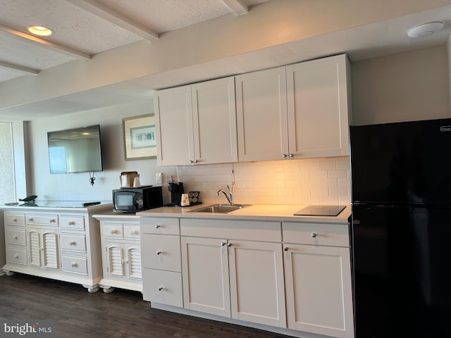 kitchen featuring decorative backsplash, white cabinetry, black appliances, dark hardwood / wood-style floors, and sink