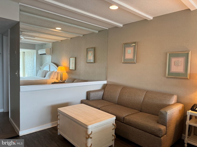 living room with beamed ceiling, dark wood-type flooring, and an AC wall unit