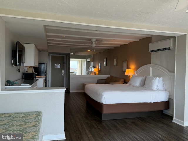 bedroom with a textured ceiling, dark hardwood / wood-style floors, and a wall mounted air conditioner