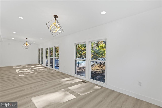 spare room featuring light wood-type flooring