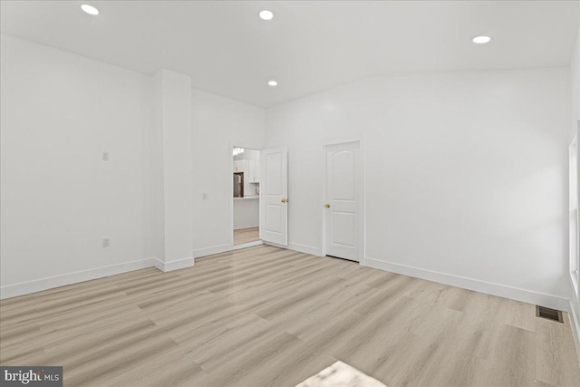 unfurnished room with light wood-type flooring