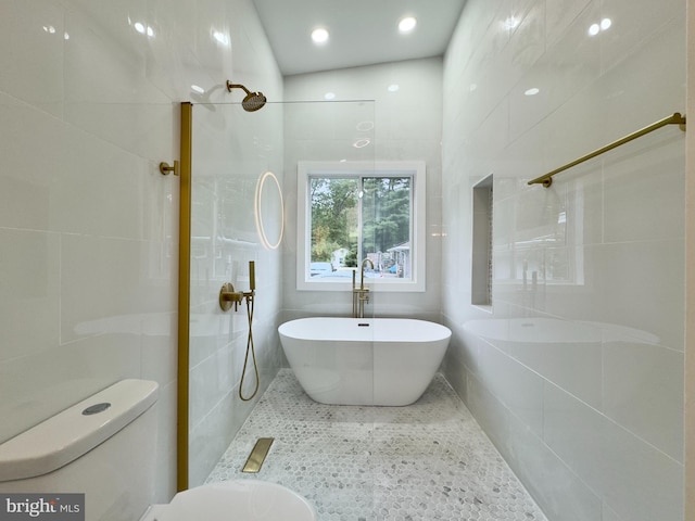 bathroom with tile walls, shower with separate bathtub, and toilet