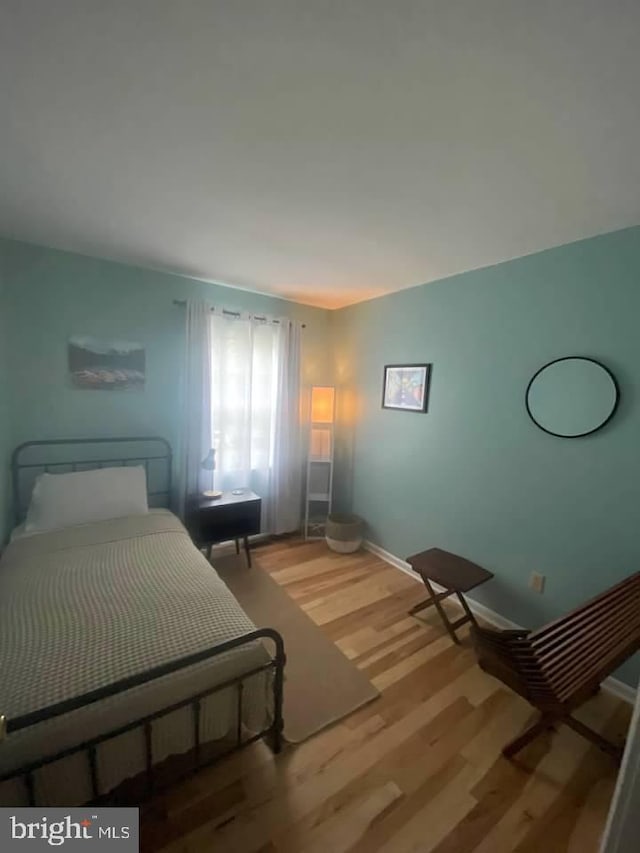 bedroom featuring hardwood / wood-style floors