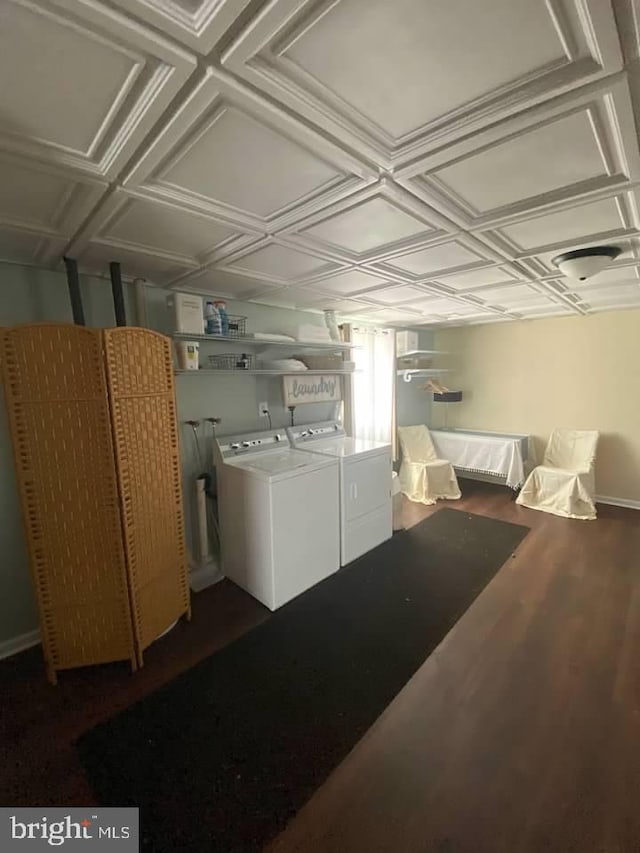 interior space with washing machine and clothes dryer and dark wood-type flooring