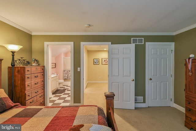 carpeted bedroom with crown molding and ensuite bathroom