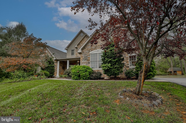 view of front of home with a front yard