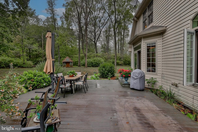 wooden deck featuring grilling area