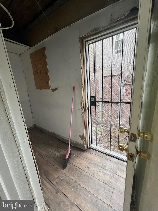 entryway with hardwood / wood-style floors