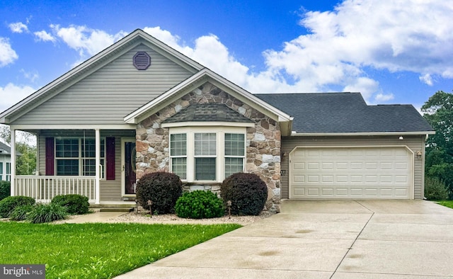 view of front of house with a porch and a garage