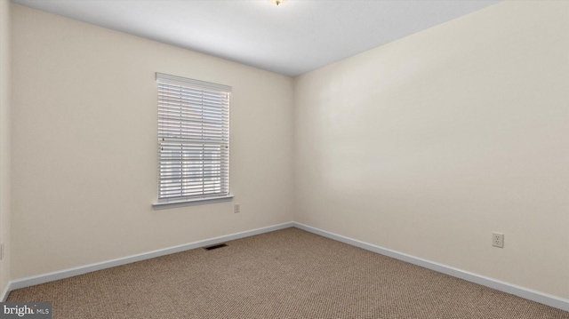 view of carpeted spare room