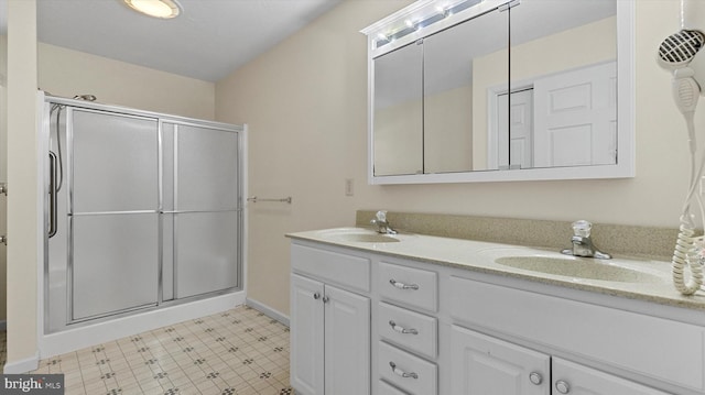 bathroom featuring vanity and an enclosed shower