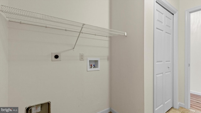 washroom featuring washer hookup, electric dryer hookup, and light hardwood / wood-style flooring