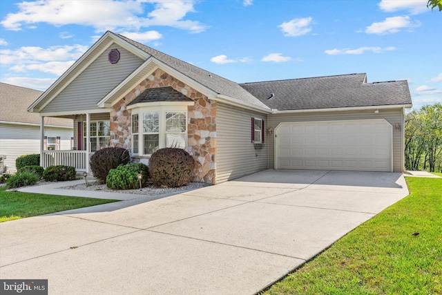 view of front of property featuring a front lawn and a garage